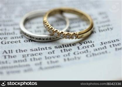 Two diamond wedding bands for a double bride wedding, on a bible verse