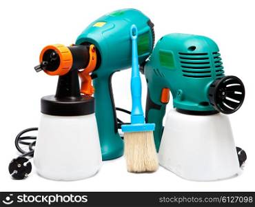 two different construction electrical spray gun for pulverization of color and a paintbrush