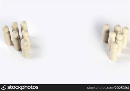 Two different groups of people standing facing to each other for equality and competition in business concept isolated on white background. Two different groups of people standing facing to each other for equality and competition in business concept.