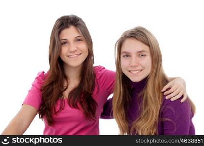 Two different sisters smiling isolated on a white background