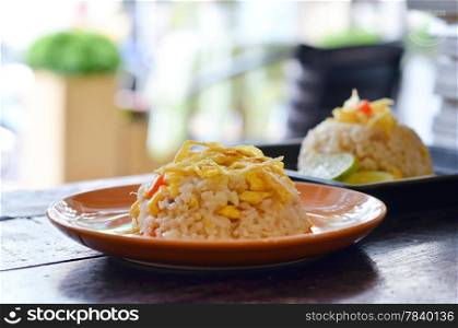 two dish of delicious fried rice on wood table