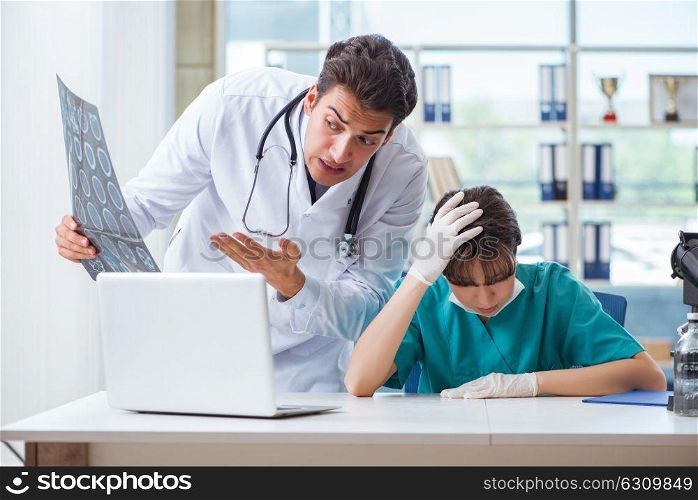 Two doctors discussing x-ray MRI image in hospital