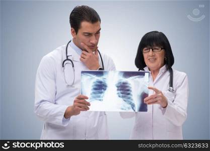 Two doctors looking at x-ray image