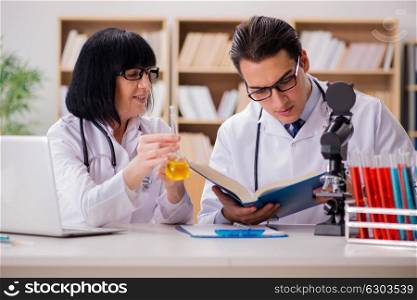 Two doctors working in the lab