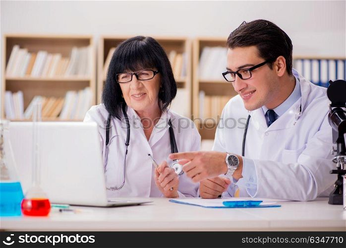 Two doctors working in the lab
