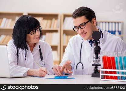 Two doctors working in the lab