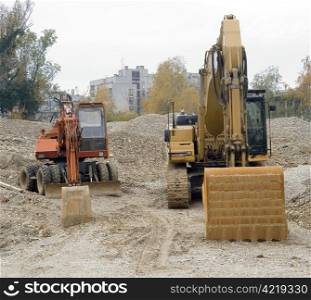 Two dozers on building site