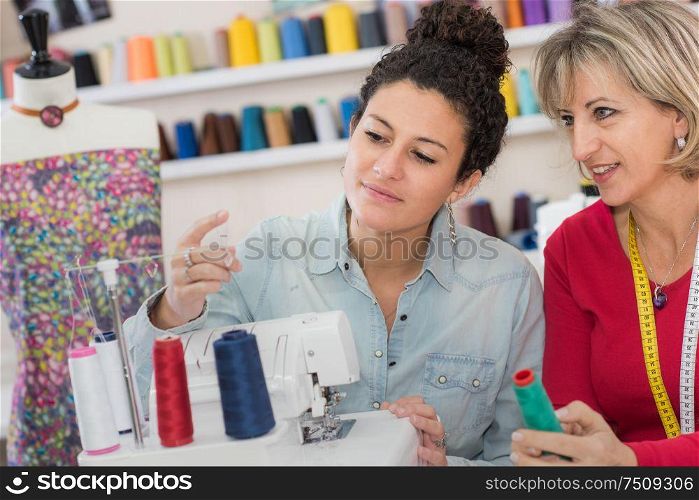 two dressmakers in their workshop