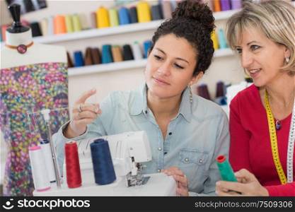 two dressmakers in their workshop
