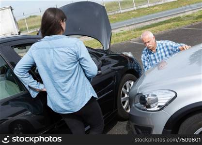two drivers arguing after traffic accident