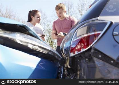 Two Drivers Exchange Insurance Details After Accident
