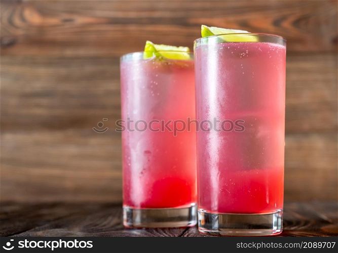 Two El Diabo Cocktails garnished with lime wedges