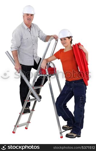 Two electrician installing wiring