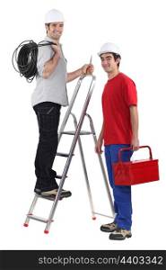 Two electrician with step ladder