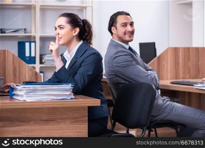 Two employees working in the office 