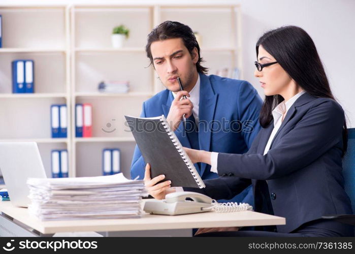 Two employees working in the office 