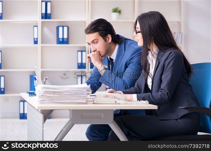 Two employees working in the office 