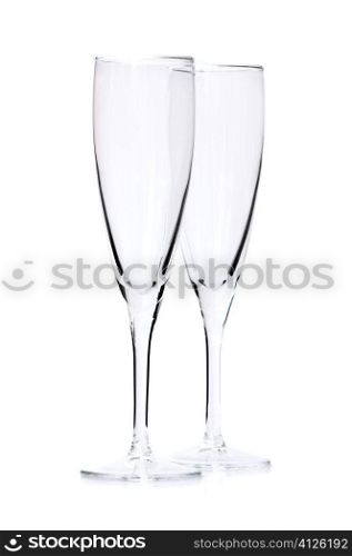 Two empty champagne flutes isolated on white background