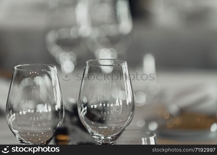 Two empty wine glasses on table in restaurant