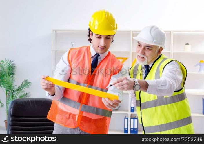 Two engineers colleagues working under project 