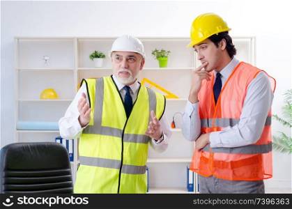 Two engineers colleagues working under project 