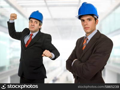 two engineers with blue hat at the office