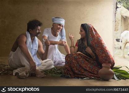 Two farmer talking with rural woman