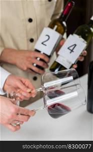 Two fema≤Sommeliers provide information about the wi≠by looking at color during sommelier training. Sommelier certification programs 