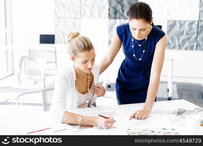 Two female colleagues in office. Two female colleagues working together in office