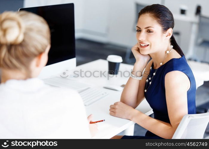 Two female colleagues in office. Two female colleagues working together in office