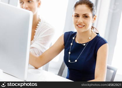 Two female colleagues in office. Two female colleagues working together in office