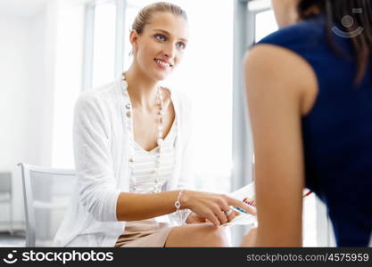 Two female colleagues in office. Two female colleagues working together in office