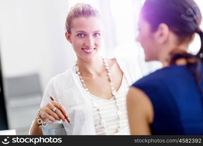 Two female colleagues in office. Two female colleagues working together in office