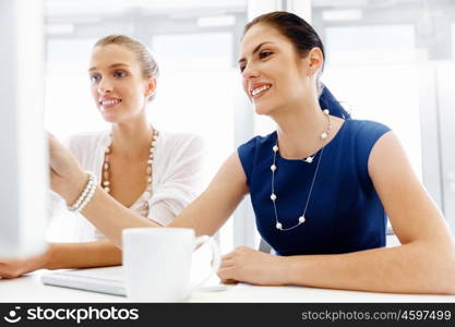 Two female colleagues in office. Two female colleagues working together in office