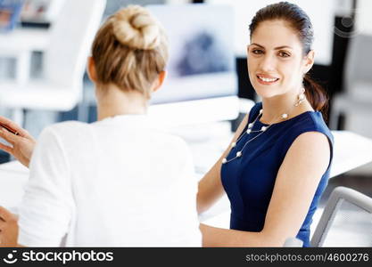 Two female colleagues in office. Two female colleagues working together in office