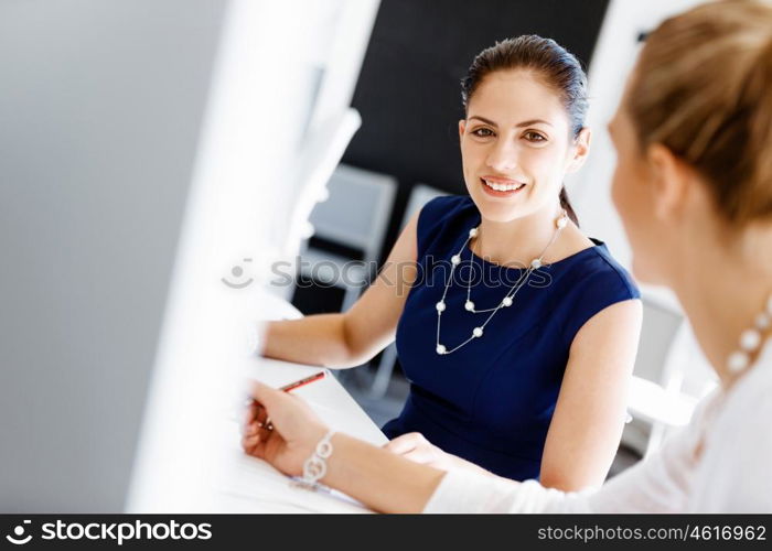 Two female colleagues in office. Two female colleagues working together in office