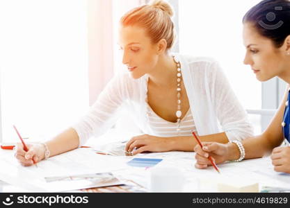 Two female colleagues in office. Two female colleagues working together in office