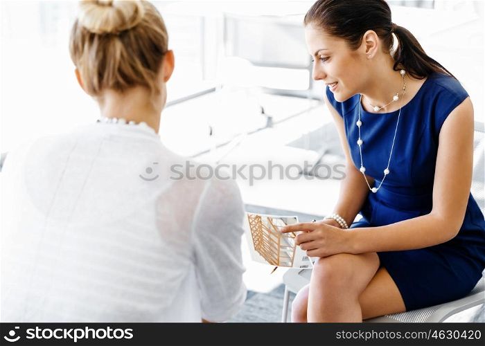 Two female colleagues in office. Two female colleagues working together in office