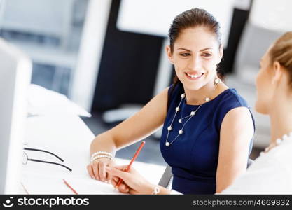 Two female colleagues in office. Two female colleagues working together in office