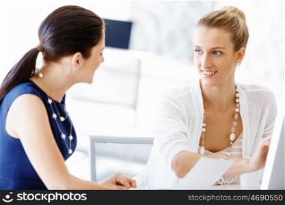 Two female colleagues in office. Two female colleagues working together in office
