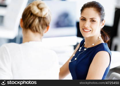 Two female colleagues in office. Two female colleagues working together in office