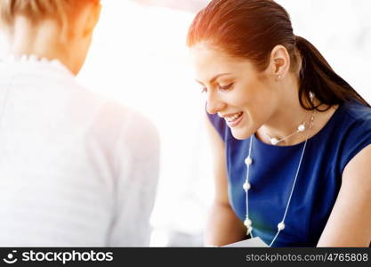 Two female colleagues in office. Two female colleagues working together in office