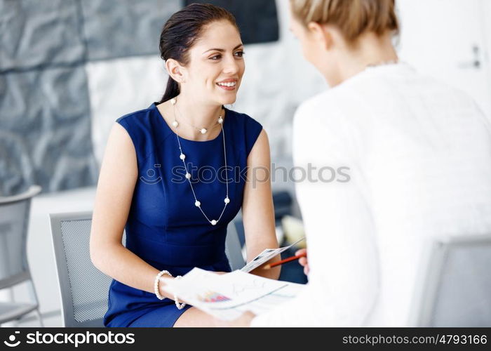 Two female colleagues in office. Two female colleagues working together in office