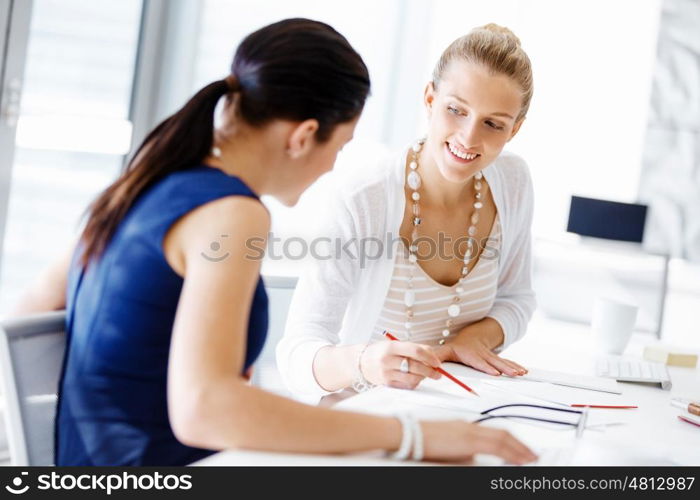 Two female colleagues in office. Two female colleagues working together in office