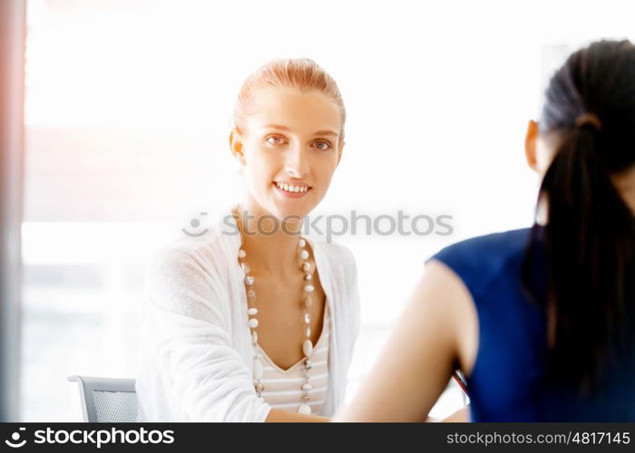 Two female colleagues in office. Two female colleagues working together in office