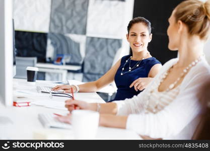 Two female colleagues in office. Two female colleagues working together in office