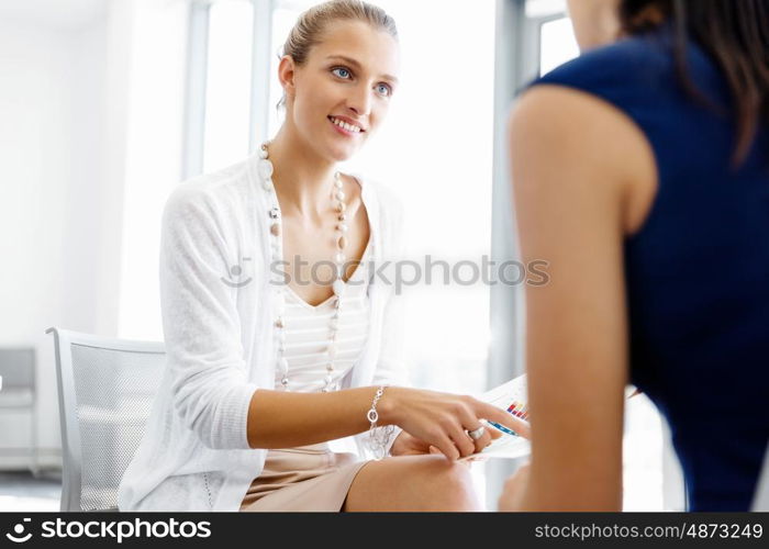 Two female colleagues in office. Two female colleagues working together in office