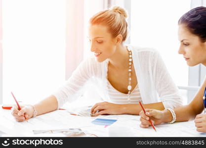 Two female colleagues in office. Two female colleagues working together in office