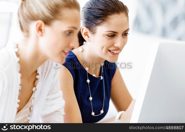 Two female colleagues in office. Two female colleagues working together in office