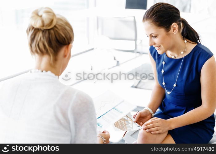 Two female colleagues in office. Two female colleagues working together in office